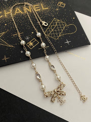 Diamond and pearl bow necklace