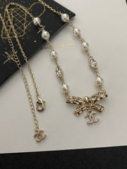 Diamond and pearl bow necklace