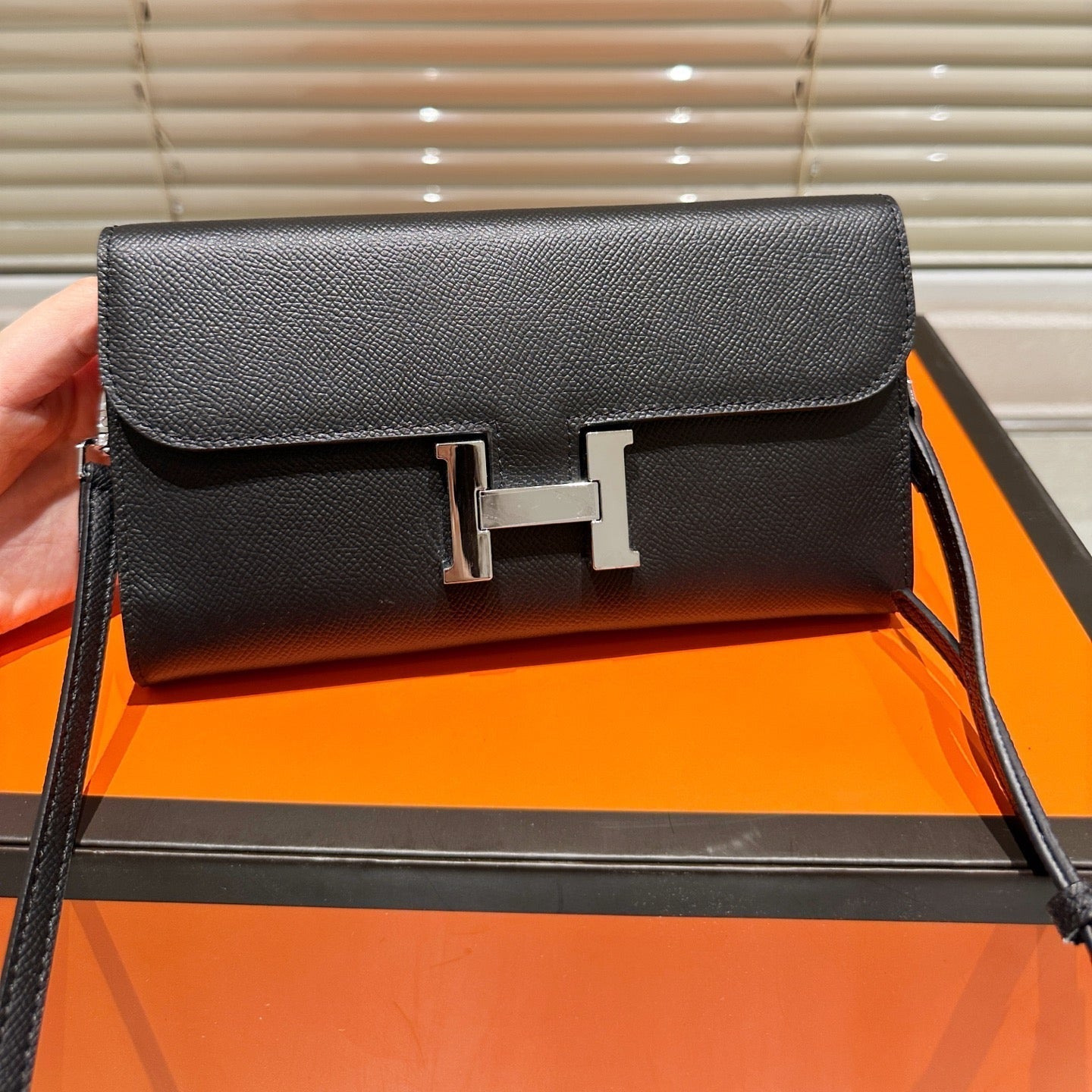 Silver buckle messenger bag