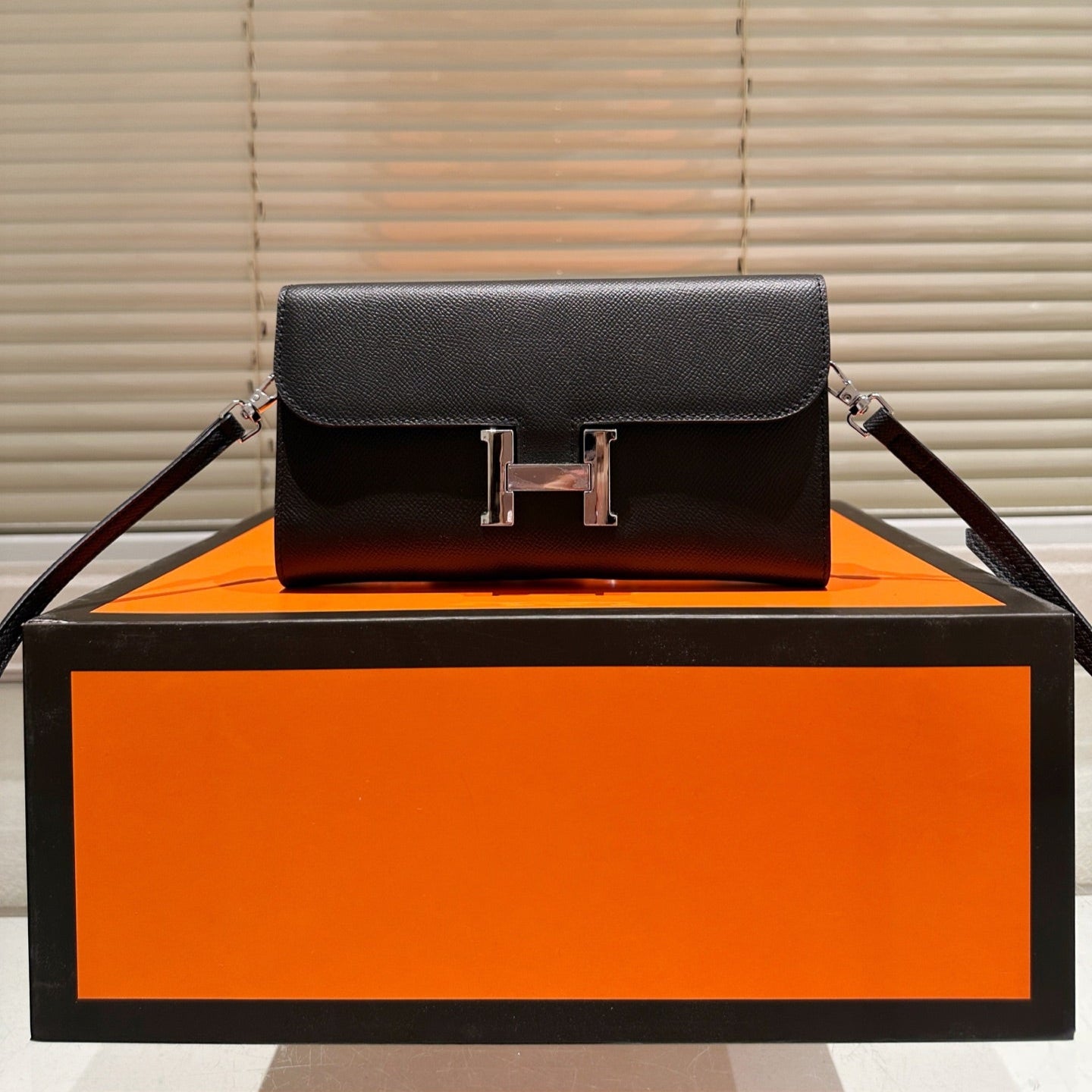 Silver buckle messenger bag