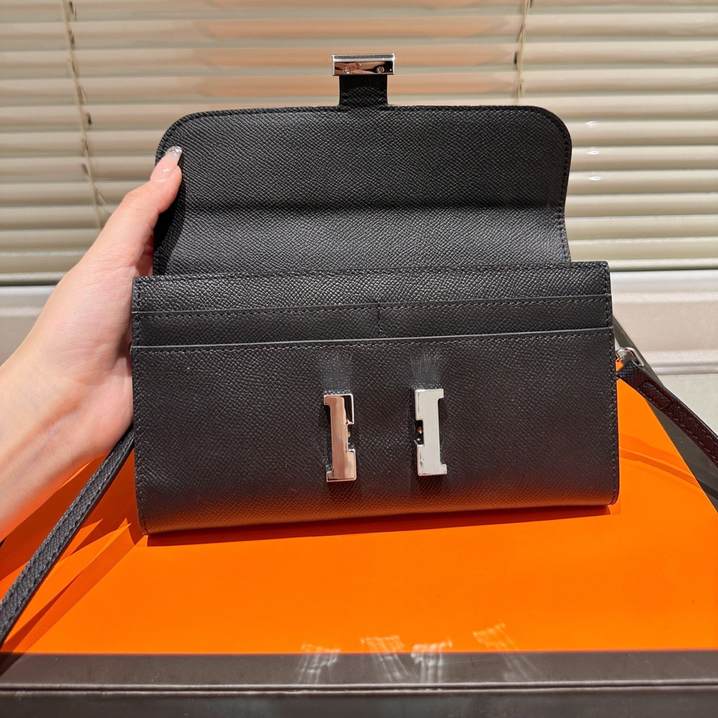 Silver buckle messenger bag
