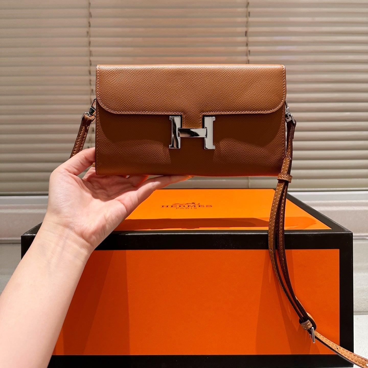 Silver buckle messenger bag