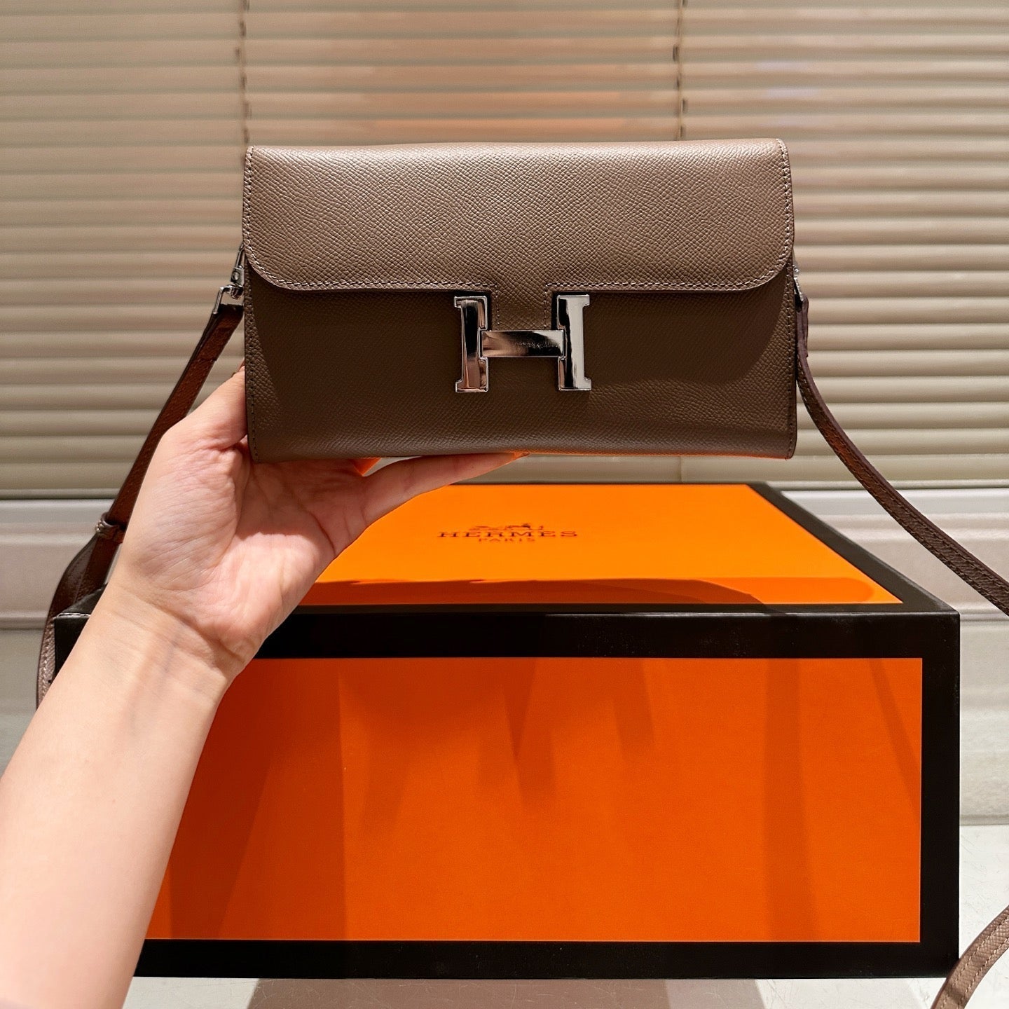 Silver buckle messenger bag